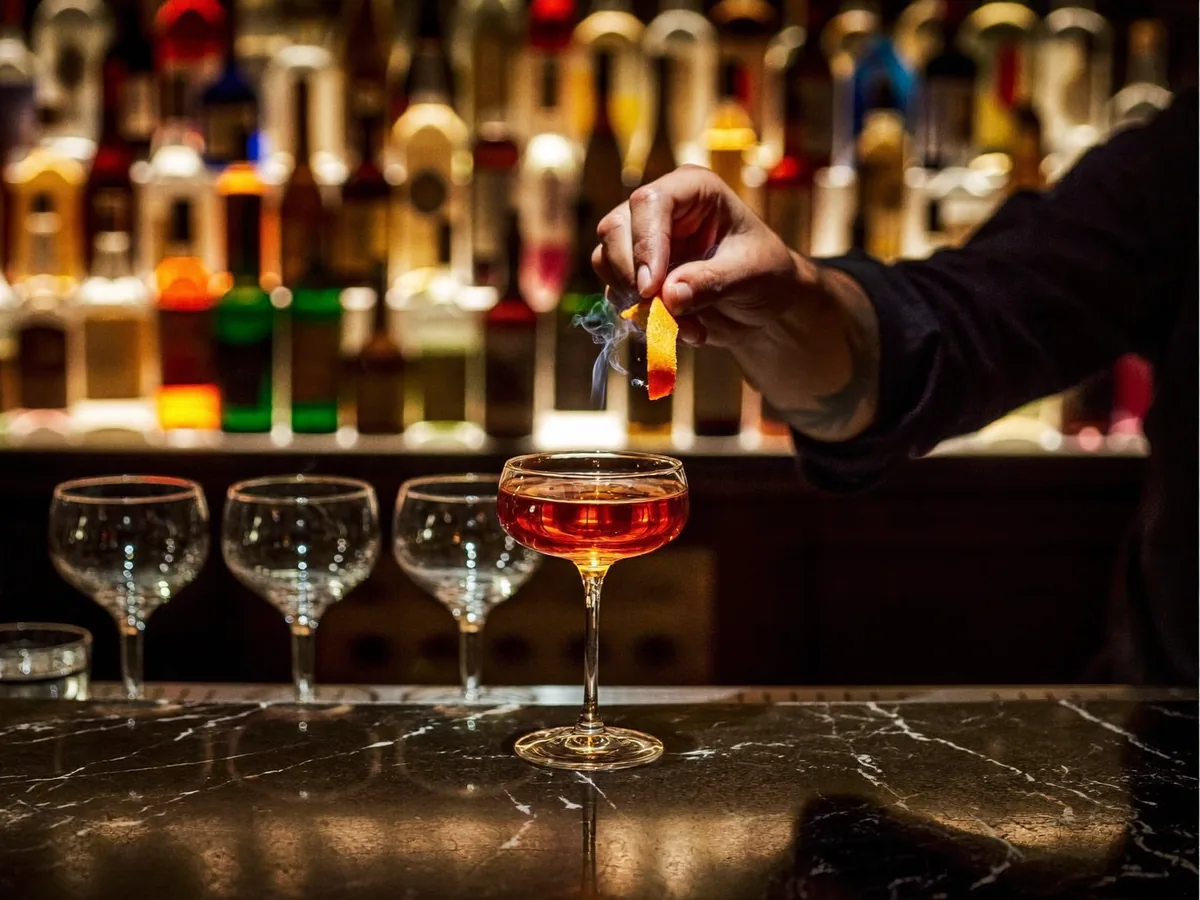 A cocktail being finished at the BANK bar